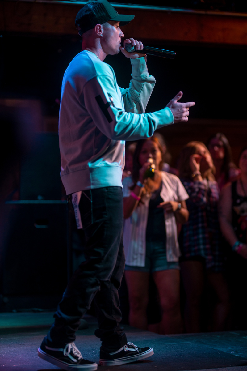Leon Budrow performing in profile before a crowd