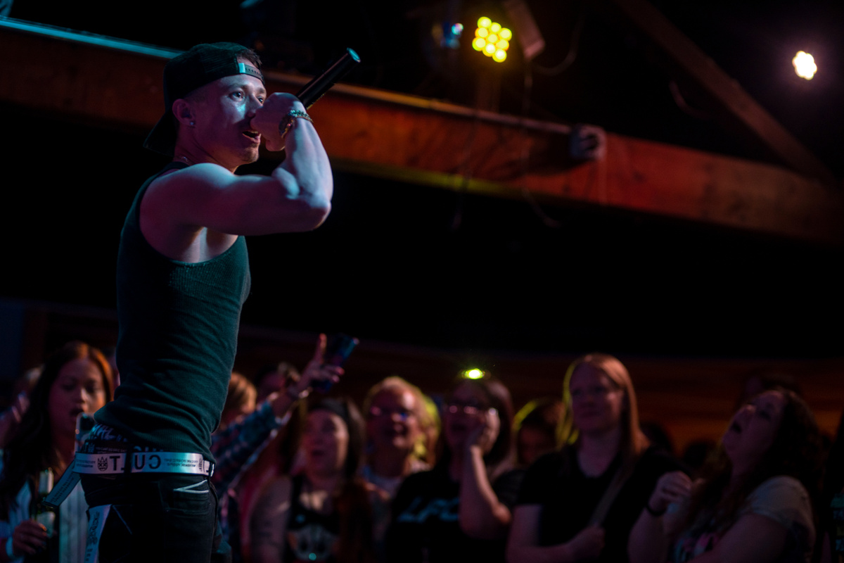 Leon Budrow on stage before a crowd